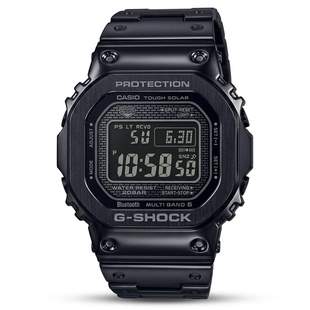 Casio G-Shock GMW-B5000 full metal black digital watch with all-black stainless steel case and bracelet, large LCD display showing Tough Solar, Bluetooth, Multi Band 6 and 20BAR water resistance on white background